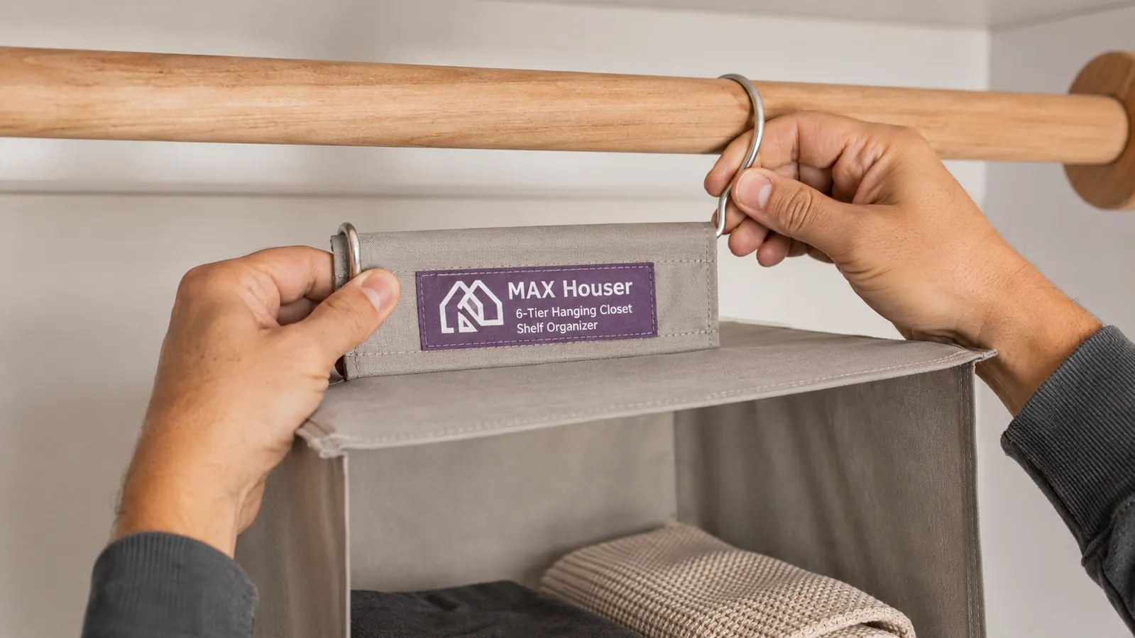 Hands clipping a hanging closet shelf onto a standard closet rod